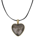 Heart-shaped pendant on black cord, part of Necklace Base Tray Pendant Mold Kit For DIY Jewelry Making With 60 Pieces Of Metal And Plastic Shapes Durable Construction For Long Lasting Use Perfect Starter Set For Beading Crafting And Pendant Projects For Crafters And Hobbyists.