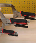 Heavy Duty 18 Inch C Clamp Locking Pliers With Swivel Pads For Welding And Woodworking 2 Piece Set in use on wooden plank