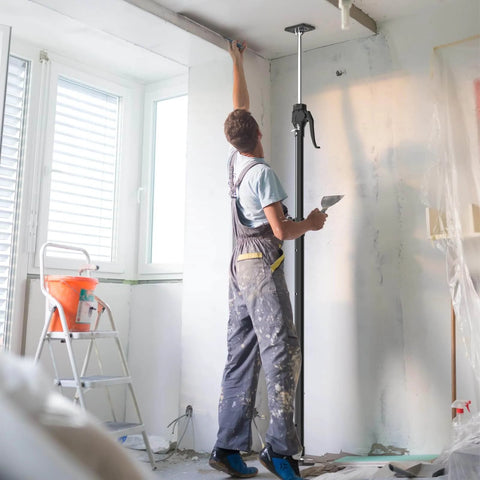 Worker using ✝️ Third Hand Support Pole Heavy Duty, Cabinet Jacks for Installing Cabinets with 154 LBS Capacity in room