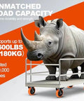 A large rhino standing on a cart demonstrating the heavy load capacity of a caster wheel set, supporting up to 2600lbs over 200,000 tests.