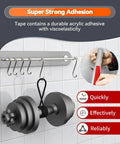 Heavy Duty Double Sided Tape Go To Outdoor Mounting Tape holding a dumbbell securely on a tiled wall