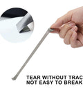Person holding Heavy Duty Double Sided Tape 0.39 Inch By 108 Feet Waterproof Foam Mounting Adhesive showcasing tear resistance.