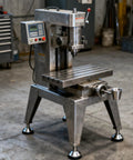 Industrial workshop setup with a silver milling machine and Built Tough Heavy Duty Leveler Leg For Cabinets And Workbenches visible on the base.