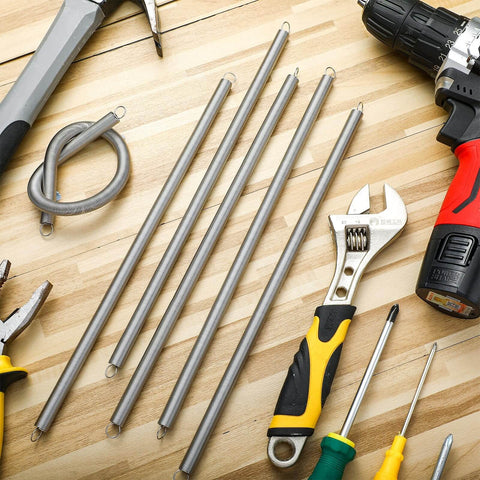 Six Pack 11.8 Inch Extension Springs With Dual Hook Ends, 0.31 Inch Wire Diameter And 0.39 Inch Coil among tools on table