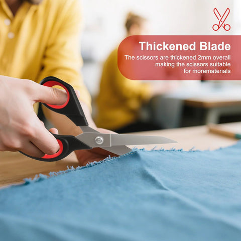 Person using heavy duty all purpose fabric scissors for sewing and garment making with stainless steel blades on thick fabric.