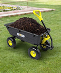 Heavy Duty Garden Dump Cart Utility Wagon with 900 LB Capacity 5 Cu Ft Bed and 10 Inch Pneumatic Tires filled with soil on grass