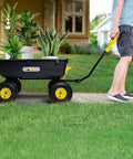 Person pulling Heavy Duty Garden Dump Cart Utility Wagon with 900 LB Capacity, 10 Inch Pneumatic Tires, 180 Degree Pivot Steering