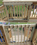 Heavy Duty Adjustable Gate Corner Brace Bracket Anti Sag Gate Kit installed on wooden fence showing solid iron support.