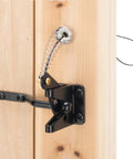 Side view of self locking gate latch for wooden fences, heavy duty gravity lever with steel spring and cable pull, black finish.