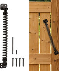 Beefy Heavy Duty Self Closing Gate Spring for outdoor gates, shown with installation hardware on wooden fence, black finish