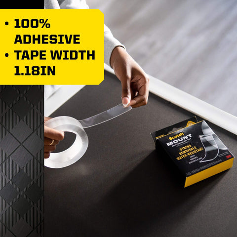 Person using Heavy Duty Double Sided Gel Tape For Removable Mounting Up To 20 Lbs On Metal Glass Tile Wood Brick And More