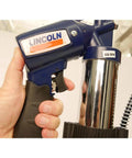 Close-up view of Heavy Duty Pneumatic Grease Gun With 30 Inch High Pressure Hose And 6000 PSI Power, held in hand