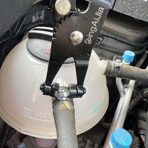 Professional Heavy Duty Hose Clamp Pliers Repair Tool With Swivel Head For Easy Removal And Installation shown in use on engine clamp