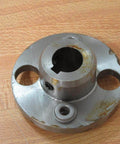 Heavy Duty Hub For Shafts And Conveyors Built To Last With Two And A Half Inch Outer Diameter Five Eighth Inch Bore One Inch Width Ideal For Industrial Power Transmission And Pulleys Model 814412 Rexnord showing front view on wooden surface.
