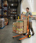 Worker using Workhorse Heavy Duty Hydraulic Material Lift With Steel Platform Board 450 lb capacity in warehouse