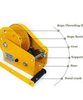Side view of yellow 1200 lb manual winch with hand crank, gear, rope reels and base
