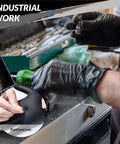 Heavy Duty Nitrile Gloves 6 Mil Black Disposable 100 Count for industrial tasks, shown in use highlighting puncture resistance.