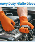 Mechanic wearing 8 Mil Nitrile Disposable Gloves Heavy Duty Mechanic Large 100 Count Powder Free while working on a car engine.