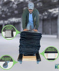 Man pushing American Made Solid Oak H Frame Furniture Dolly For Moving Heavy Loads 18 By 30 Inches With Non Slip Grip And 3.5 Inch Thermo Rubber Wheels 900 Lb Capacity Kiln Dried Red Oak Construction Movers Grade By CasterHQ with blankets.