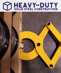 Beefy Heavy Duty Pallet Puller Clamp With 6000 Lb Capacity in use, clamping onto wooden pallet, showing solid steel construction.