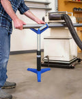 Man using ✝️ V-Head Heavy-Duty Roller for Woodworking - 1,760 Lb Load Capacity, Adjustable Height 22.83-38.19 Inches in workshop
