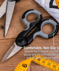 Heavy Duty 5.5 Inch Stainless Steel Scissors With Power Notch For Precision Cutting, comfortable grip shown on wooden table.
