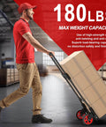 Man using ✝️ Heavy-Duty Steel Folding Hand Truck, 180LB Capacity Dolly cart with Telescoping Handle in warehouse loaded with boxes.