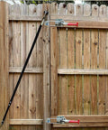 Heavy duty toggle clamp latch holds up to 2000 lbs installed on wooden gate, showcasing 4mm cold rolled steel and galvanized finish.