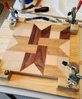 Heavy Duty 5 Pack Hold Down Toggle Clamps With Quick Release, 200 Lb Holding Capacity, securing wooden panel with star pattern.