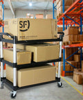 Heavy Duty Plastic Utility Cart With Locking Wheels And 550 Pound Capacity, Big Boss Restaurant Service Cart loaded with boxes in a warehouse