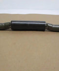 One of the (4) weld on trailer ramp door hinges 1 inch by 10 inch 9 gauge raw steel with integrated grease fitting heavy duty