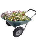 Heavy Duty Dual Wheel Garden Wheelbarrow Cart with Built In Stand filled with flowers for yard utility use