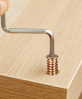 Inserting a metric threaded wood insert into wood surface using hex key from 200 Piece Metric Threaded Wood Inserts Kit M4 M5 M6 M8 M10 With Flanged Hex Socket Drive For Quick Furniture Fix And DIY Woodworking Projects Zinc Plated Finish For Extra Grip And Long Lasting Strength In Cabinets Shelves And DIY Builds
