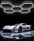 Hexagon LED Garage Light Fixture Dope Bright 6500K 156W 17280LM installed in a garage ceiling above a sports car
