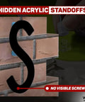 Acrylic Sign Mounting Hardware Hidden Clip In Sign Standoff Mounts on brick wall with no visible screws, close-up of installation.