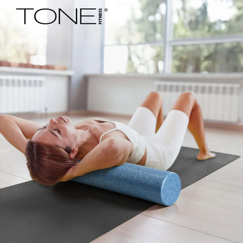 Woman using High Density EPP Foam Exercise Roller for Yoga Pilates Stretching Massage and Recovery 36 Inch Black with firm pressure