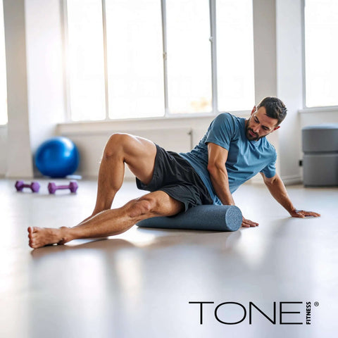 Man using High Density EPP Foam Exercise Roller For Yoga Pilates Stretching Massage And Recovery 36 Inch Black for leg massage
