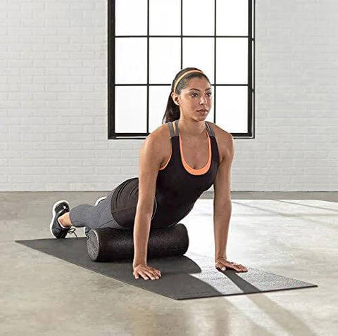 High Density Foam Roller For Exercise And Recovery 18 Inches Black With Durable Polypropylene Core in use during workout