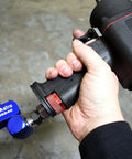 High Flow 3-Way Air Swivel in use with impact wrench, showcasing 360 degree motion and compact design for heavy-use shop setups