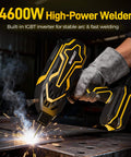 Person using a 4600W high-power welder with built-in IGBT inverter for stable arc and fast welding on metal surface, wearing glove
