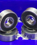 High Precision 8-Pack Skateboard Si3N4 Ceramic ABEC-7 Ball bearings displayed from a front view on a blue background.