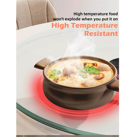 High temperature food in a pot on an 18.9 inch tempered glass lazy susan rotating serving tray, demonstrating heat resistance.