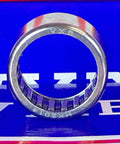 Front view of HK2014 Needle Roller Bearing 20x26x14mm - Shell-Type on a blue background, showing metallic rollers.