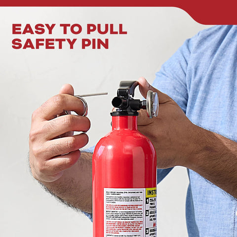 Person pulling pin on Multi Purpose Fire Extinguisher 1A10BC For Home Office Dorm And Residential Use All Metal Construction