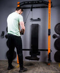 Man using Upgraded Cable Pulley System For Home Gym LAT And Lift Attachments with weights in a gym setup