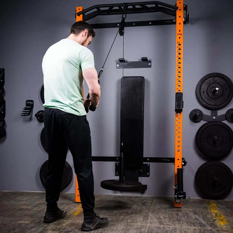 Man using Upgraded Cable Pulley System For Home Gym LAT And Lift Attachments with weights in a gym setup