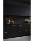 Modern kitchen with Barrow 7-9/16 Inch Center To Center Cabinet Pull TK1054HB Honey Bronze Finish on black cabinets.
