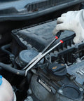 Using Three Piece Beefy Hose Gripper Pliers Set Spark Plug Pliers on automotive hose in engine bay, carbon steel with machined jaws.