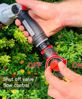 Hand operating a shut-off valve on a garden hose quick connect kit with water stop and flow control 9 piece snap and lock fittings.
