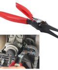 Automotive Hose Removal Pliers For Fuel And Vacuum Lines Stubborn Hose Separator Tool used on a car engine pipe with red rubber grips.